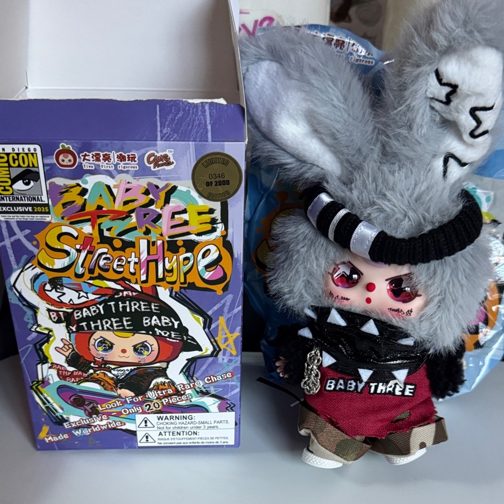 COMIC-CON 2025 Exclusive Baby Three Street Hype plush with key ring.